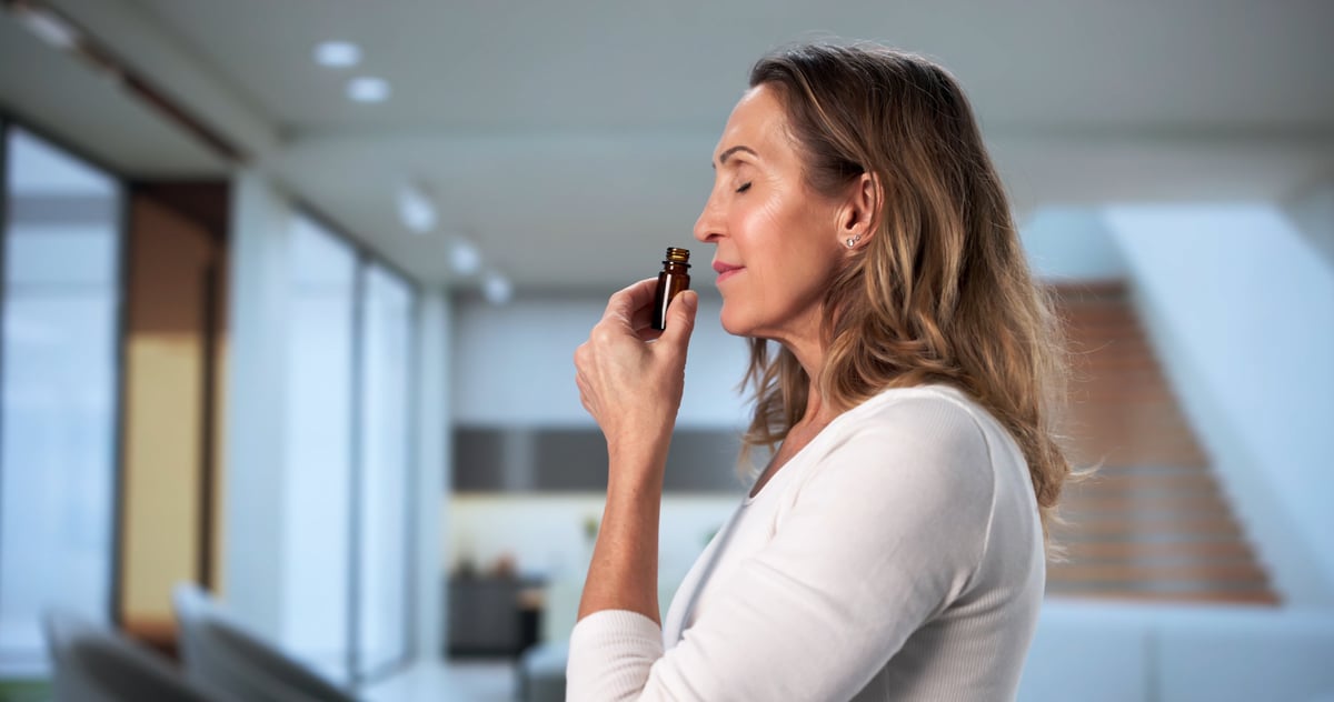 Therapeutic aromatherapy session helping a woman relax